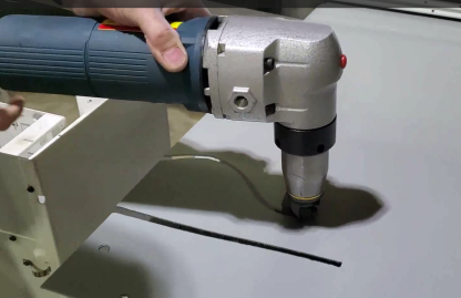 demo of motion constrained sheet metal nibbler